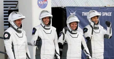 NASA's stranded astronauts greet their replacements at space station