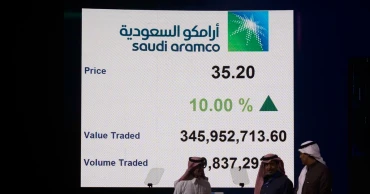 Saudi’s oil giant Aramco reports decline in annual profit, cuts dividend