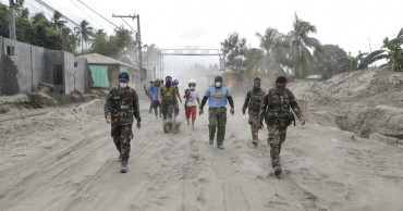 Philippine volcano simmers, officials brace for long crisis