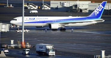 Virus cases in China top SARS as evacuations begin