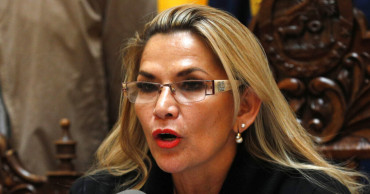 Bolivian lawmakers approve new elections, bar ex-president