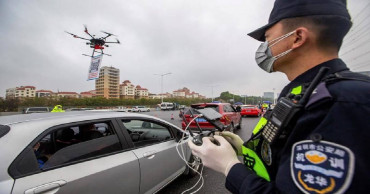 China's new virus cases fall again, deaths now exceed 1,100