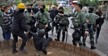 Hong Kong police fire tear gas as thousands rally