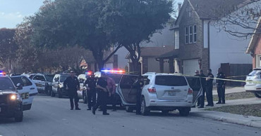 Man kills woman with knife in front of children, wounds teen