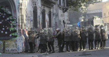 Rights groups protest ramming of protester in Chile