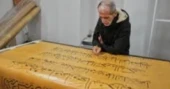 Iraqi calligrapher completes massive handwritten Quran after six years