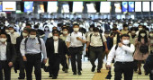 Trains packed with commuters as Japan fully ends emergency